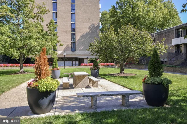 a view of a house with backyard sitting area and garden