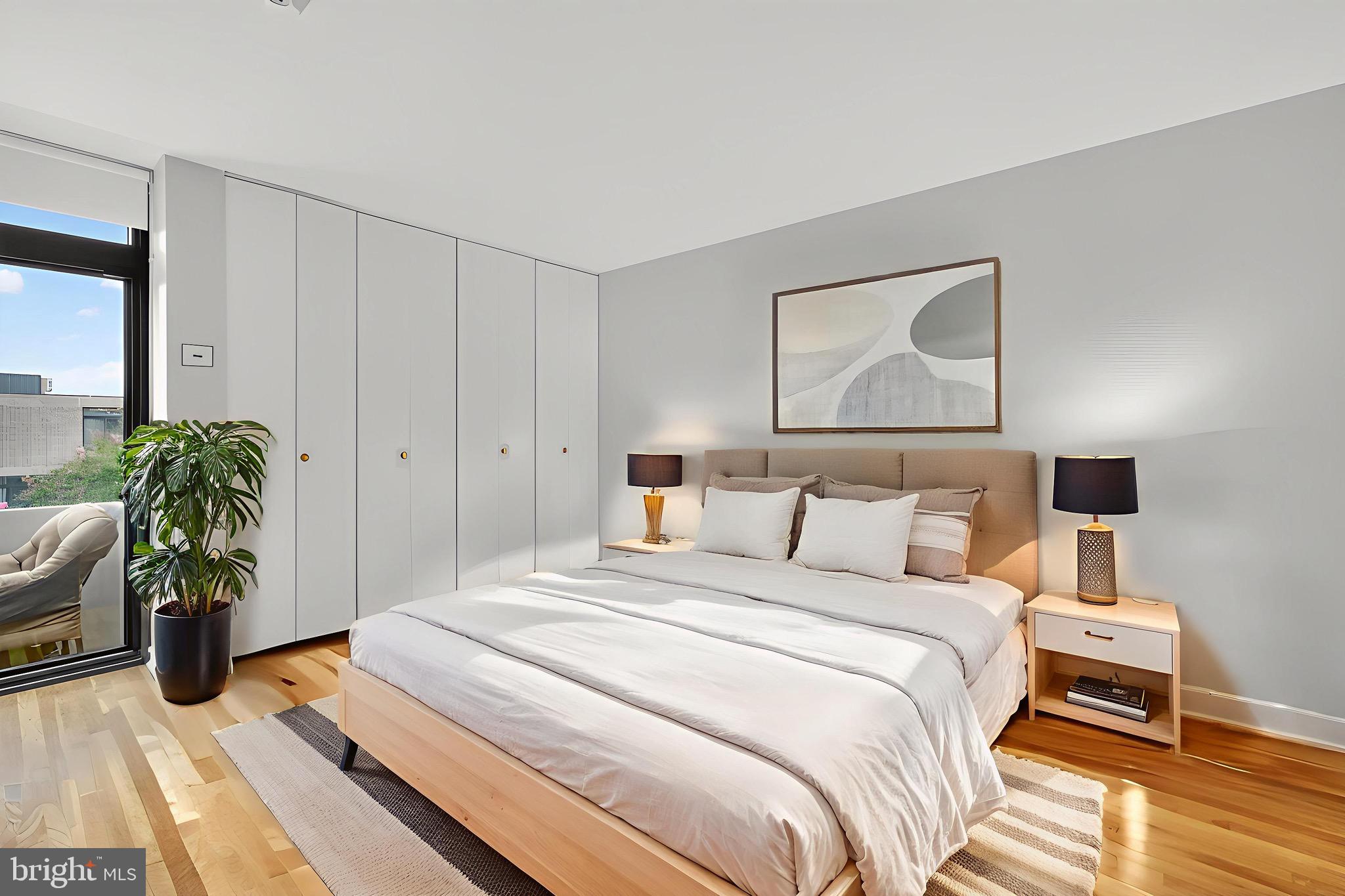 333 N Street Southwest, Unit 333 Washington, DC 20024 - Photo 6 of 25 a bedroom with a bed and a potted plant