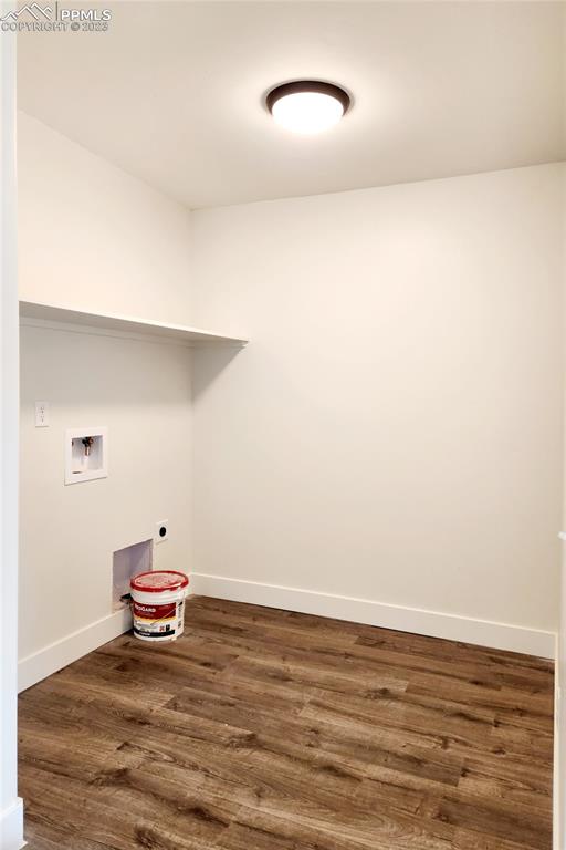 704 Elm Street Pueblo, CO 81004 - Photo 8 of 22 a view of a room with an empty space and wooden floor