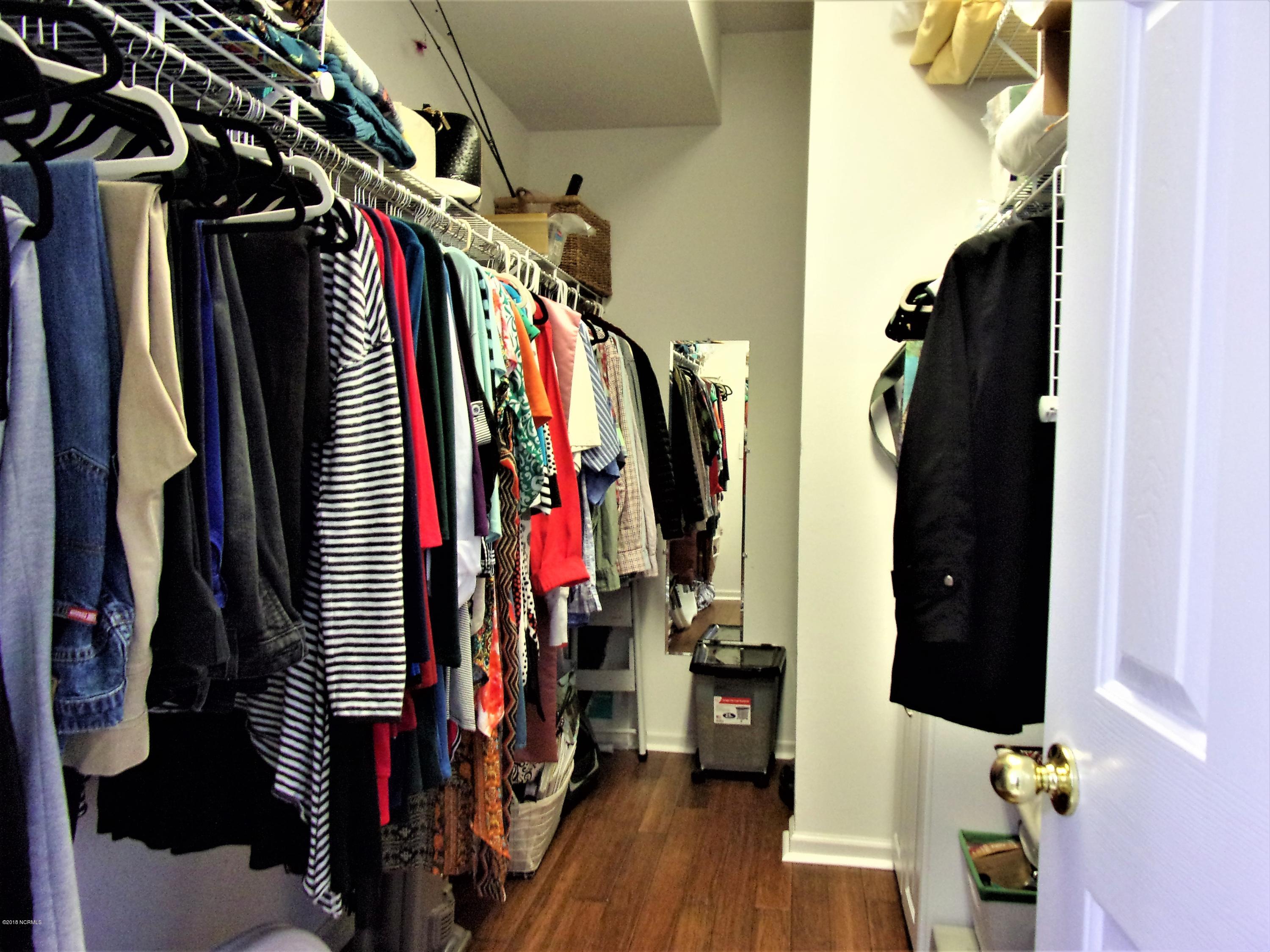 116 Rice Mill Circle, Unit 1 Sunset Beach, NC 28468 - Photo 14 of 24 master walkin closet with bamboo floorin