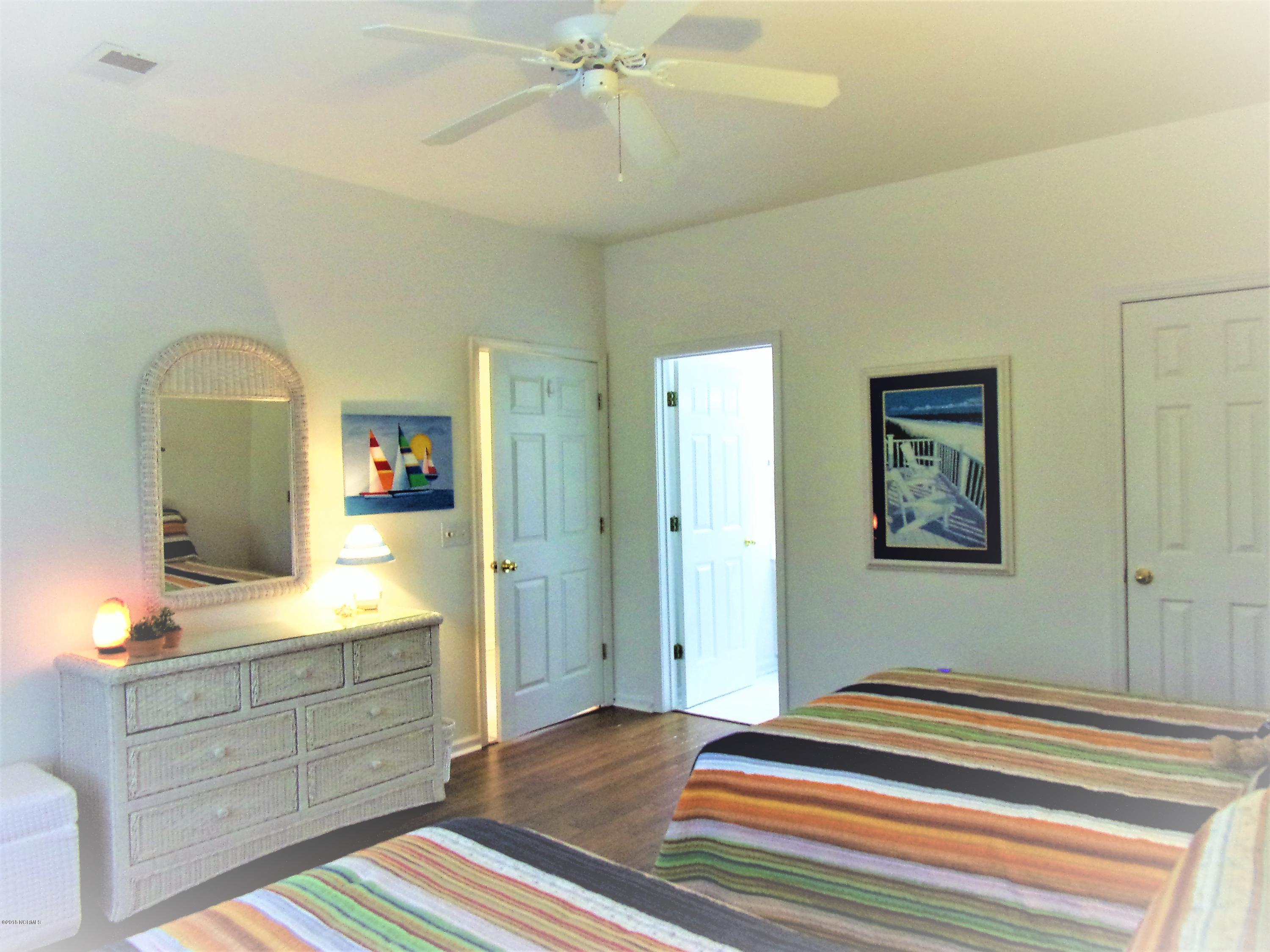 116 Rice Mill Circle, Unit 1 Sunset Beach, NC 28468 - Photo 17 of 24 guest bedroom bath entrance