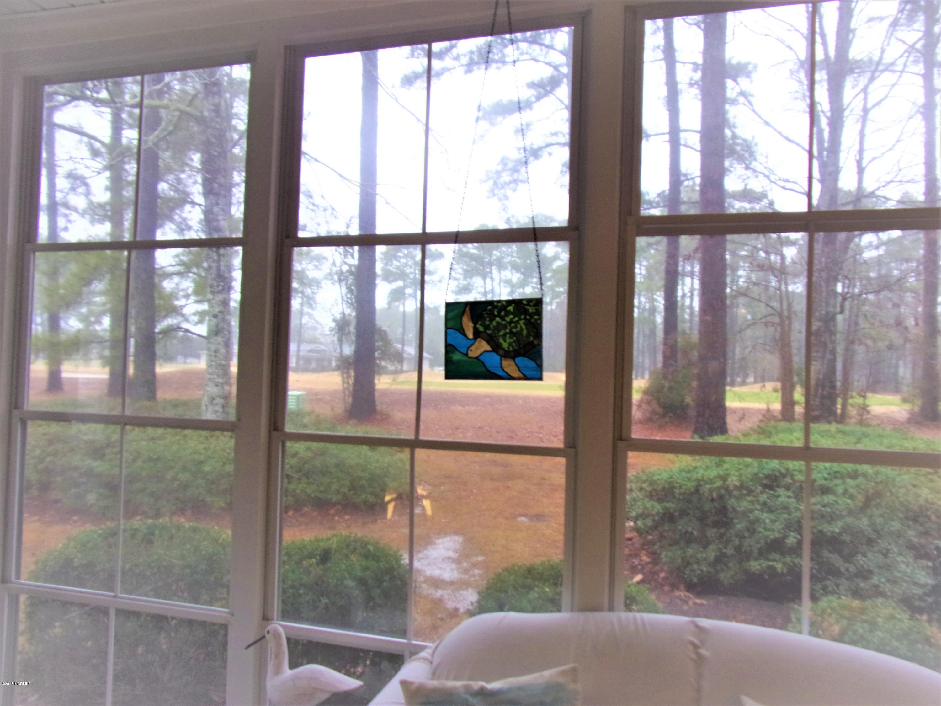 116 Rice Mill Circle, Unit 1 Sunset Beach, NC 28468 - Photo 23 of 24 view from 3 season room