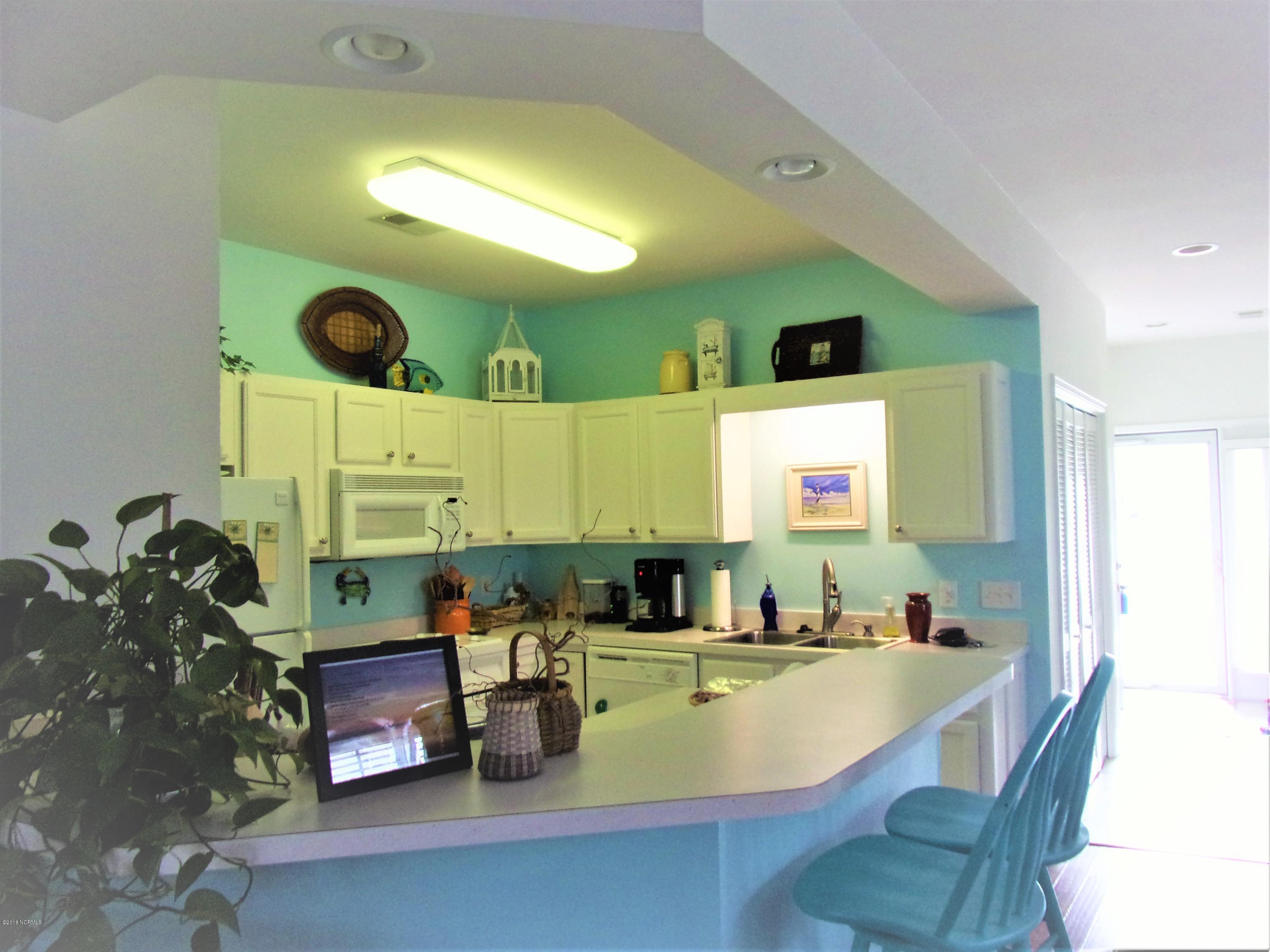 116 Rice Mill Circle, Unit 1 Sunset Beach, NC 28468 - Photo 6 of 24 kitchen from living room