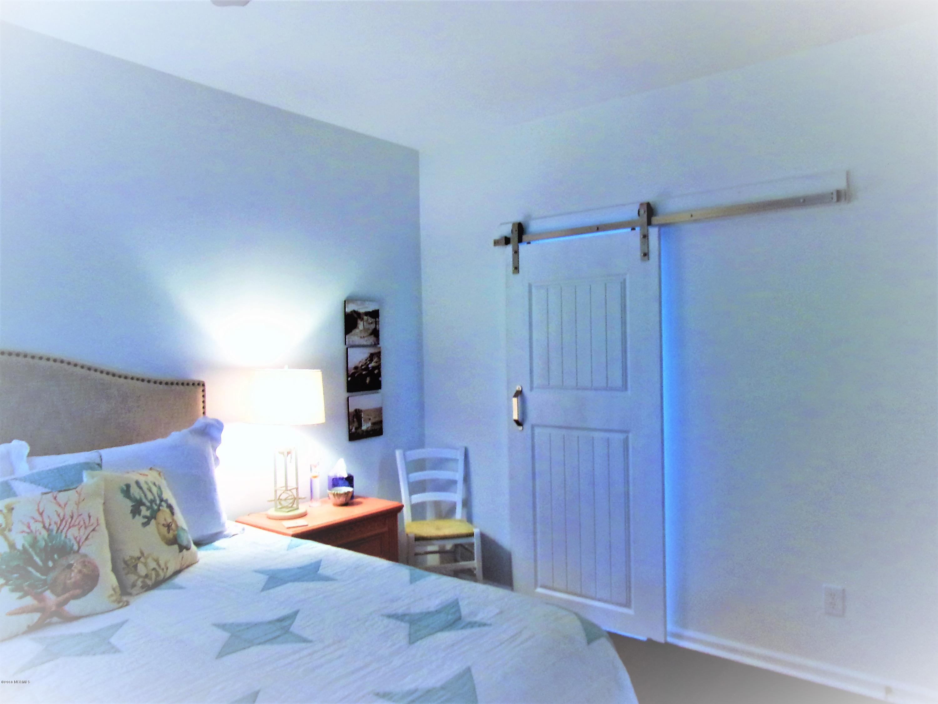 116 Rice Mill Circle, Unit 1 Sunset Beach, NC 28468 - Photo 10 of 24 barn door