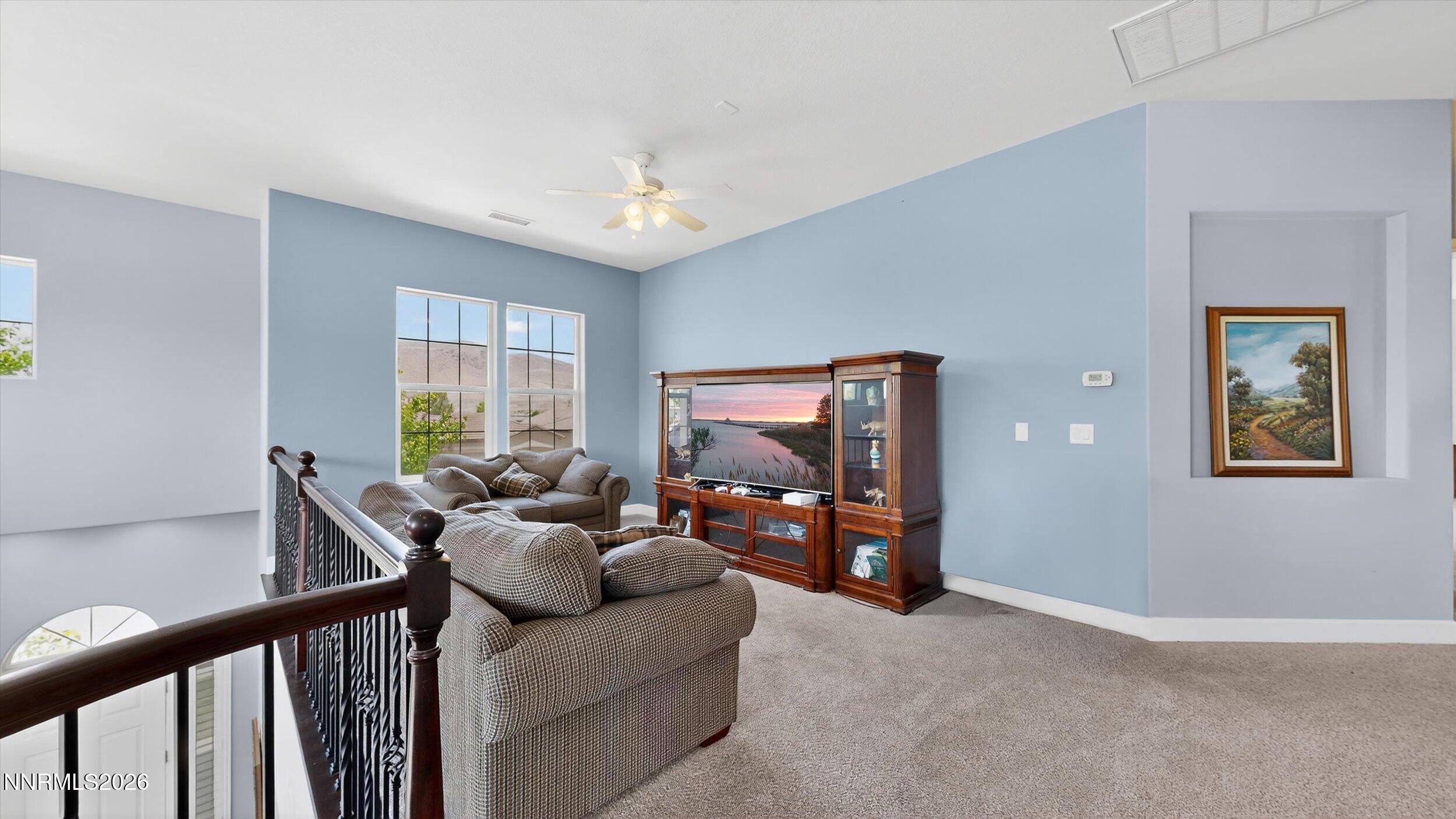 2920 Bull Rider Drive Reno, NV 89521 - Photo 19 of 51 a living room with furniture and a flat screen tv