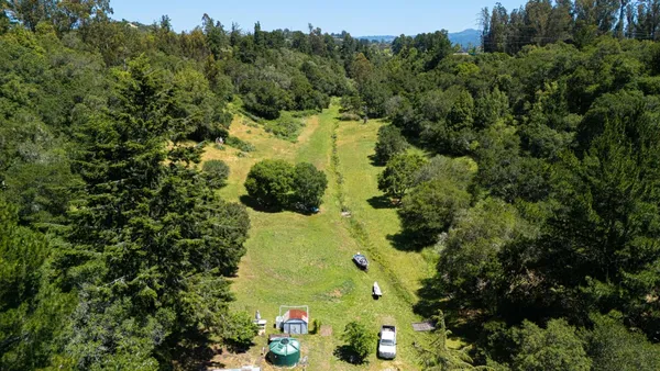 a view of a lake with a yard