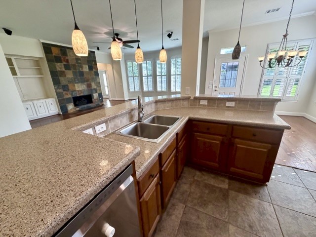 1810 Rippling Water Court Sugar Land, TX 77479 - Photo 11 of 37 Pretty decorative pendant fixtures give ample lighting in the kitchen.