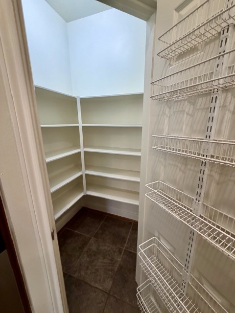 1810 Rippling Water Court Sugar Land, TX 77479 - Photo 16 of 37 Large walk-in pantry with convenient racks for spices and other smaller items.