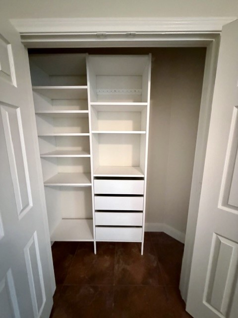 1810 Rippling Water Court Sugar Land, TX 77479 - Photo 34 of 37 Secondary bedroom closet with additional shelves and drawers.