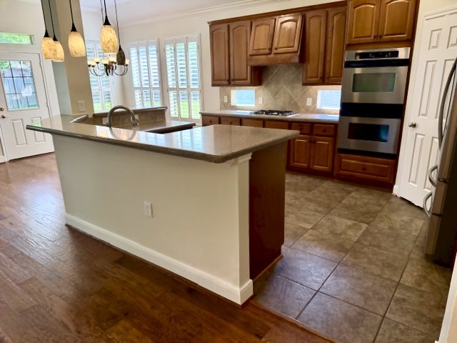 1810 Rippling Water Court Sugar Land, TX 77479 - Photo 7 of 37 High bar with room for bar stools.
