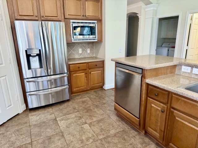 1810 Rippling Water Court Sugar Land, TX 77479 - Photo 10 of 37 Notice the dishwasher is at a higher level for easy access and the quality two door, two drawer stainless refrigerator with the convenient water/ice dispenser.
