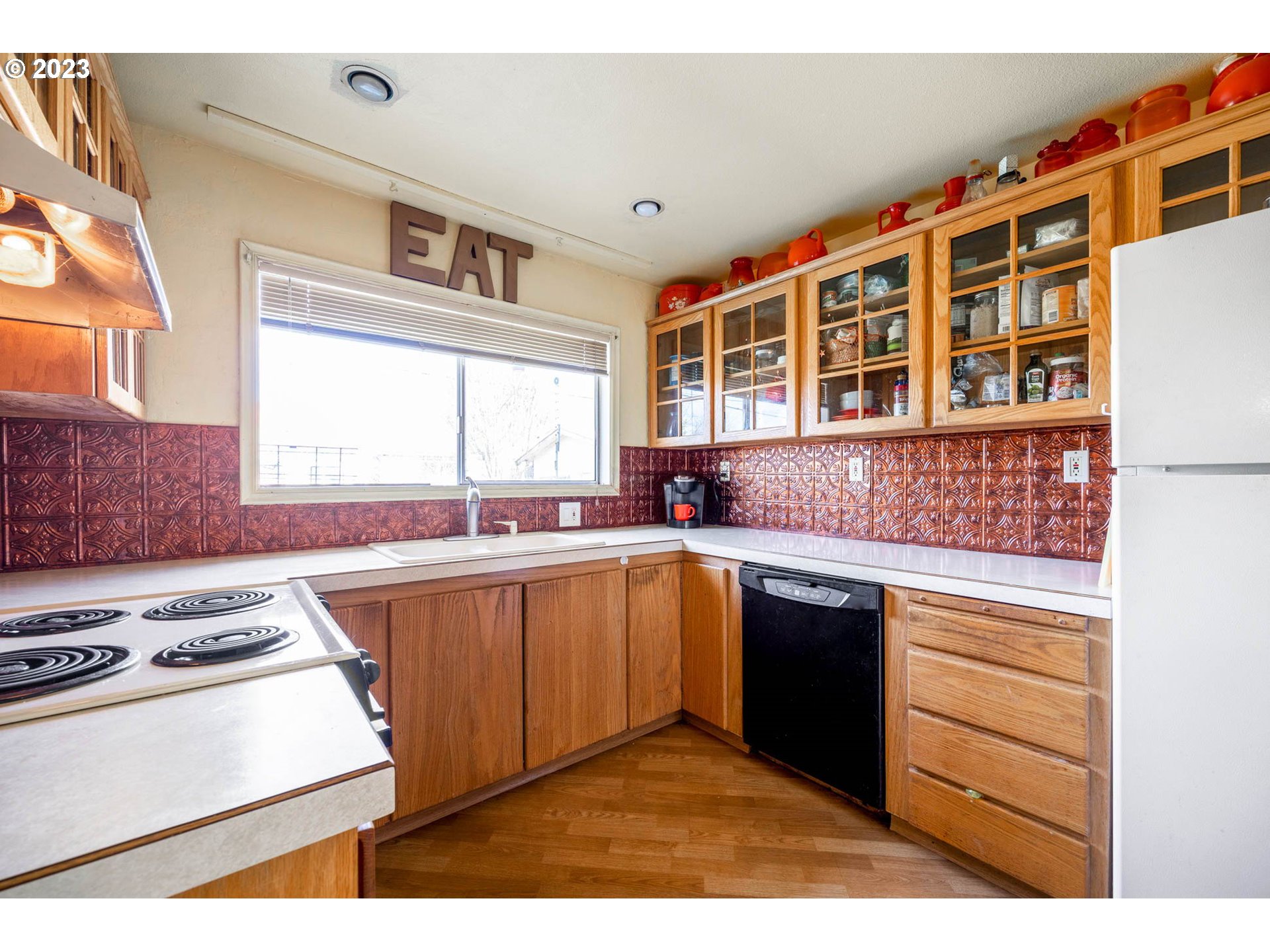 1420 Modoc Street Springfield, OR 97477 - Photo 7 of 22 a kitchen with stainless steel appliances granite countertop a stove and a sink
