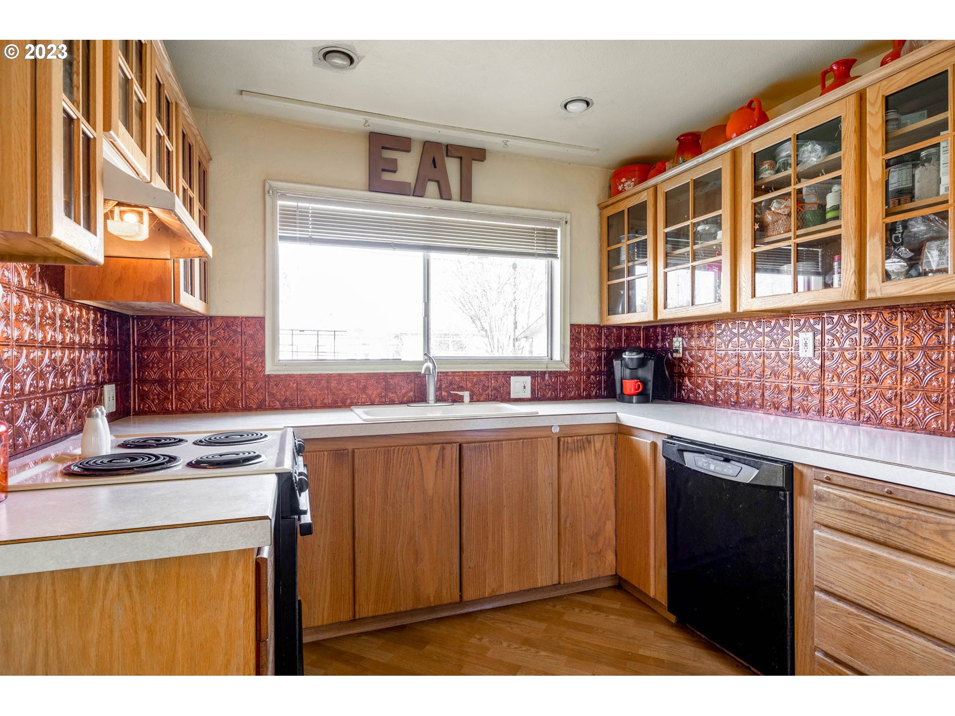 1420 Modoc Street Springfield, OR 97477 - Photo 8 of 22 a kitchen with stainless steel appliances granite countertop a sink stove and cabinets