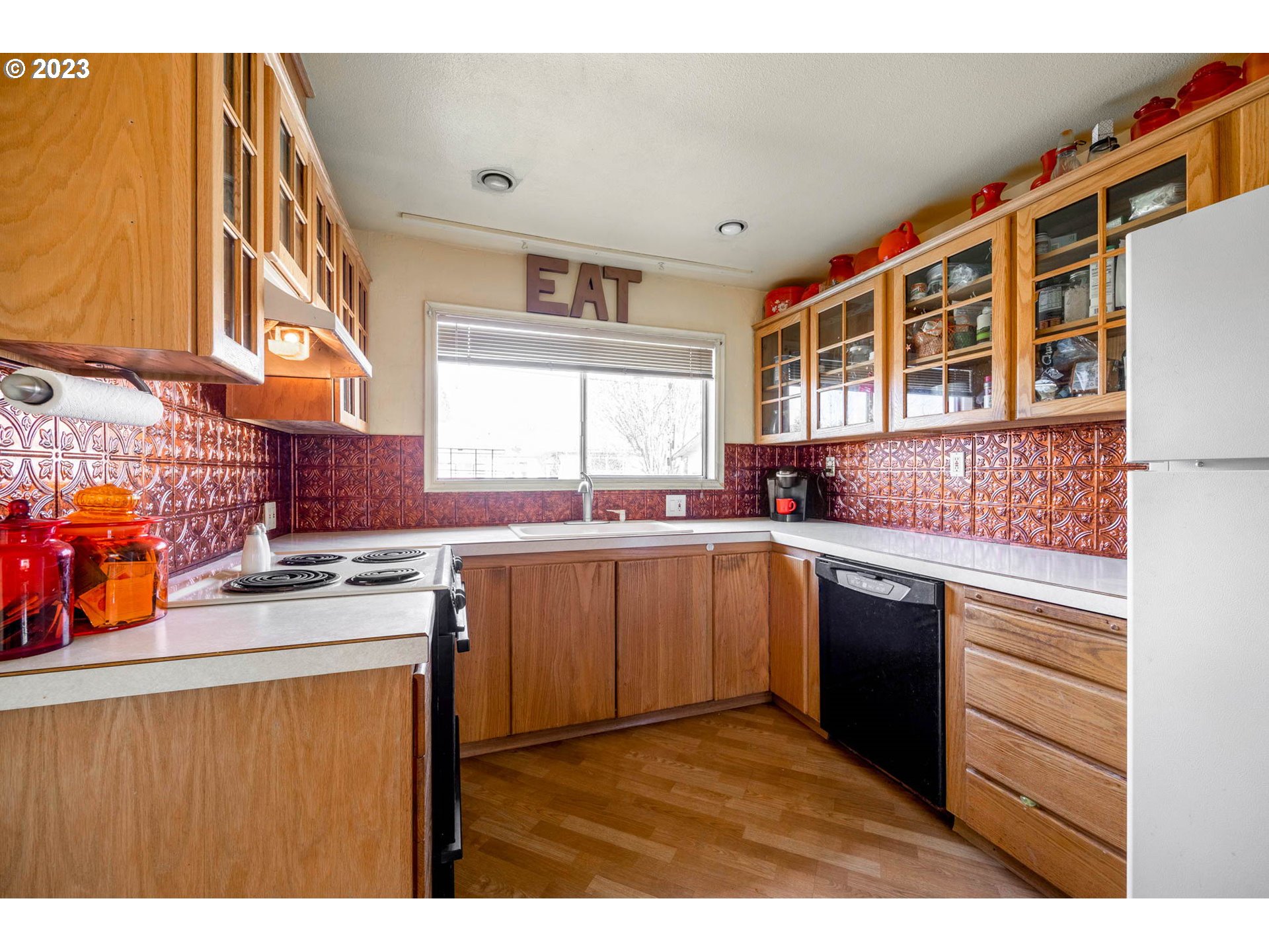 1420 Modoc Street Springfield, OR 97477 - Photo 9 of 22 a kitchen with stainless steel appliances granite countertop a sink stove and cabinets