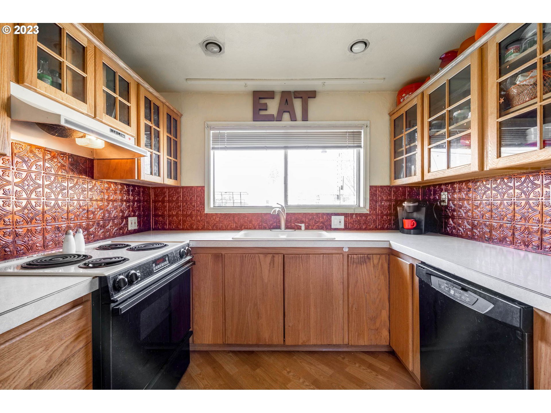 1420 Modoc Street Springfield, OR 97477 - Photo 10 of 22 a kitchen with stainless steel appliances granite countertop a stove and a sink