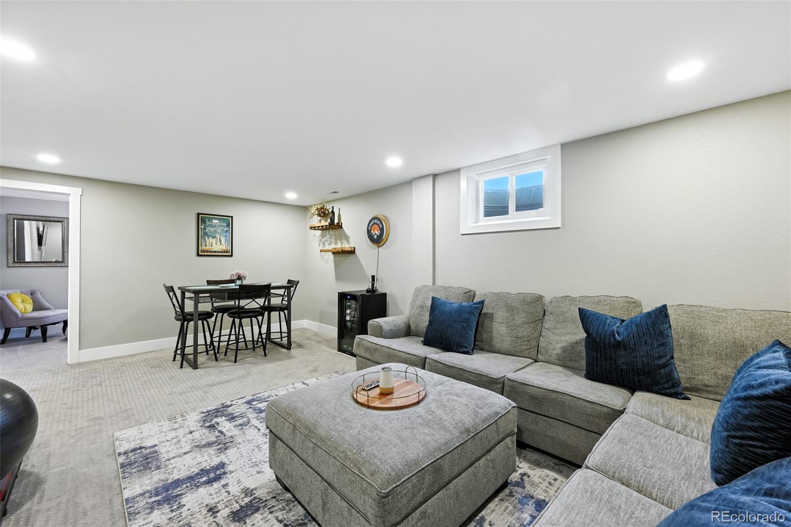 2714 South Raleigh Street Denver, CO 80236 - Photo 21 of 34 a living room with furniture and a table