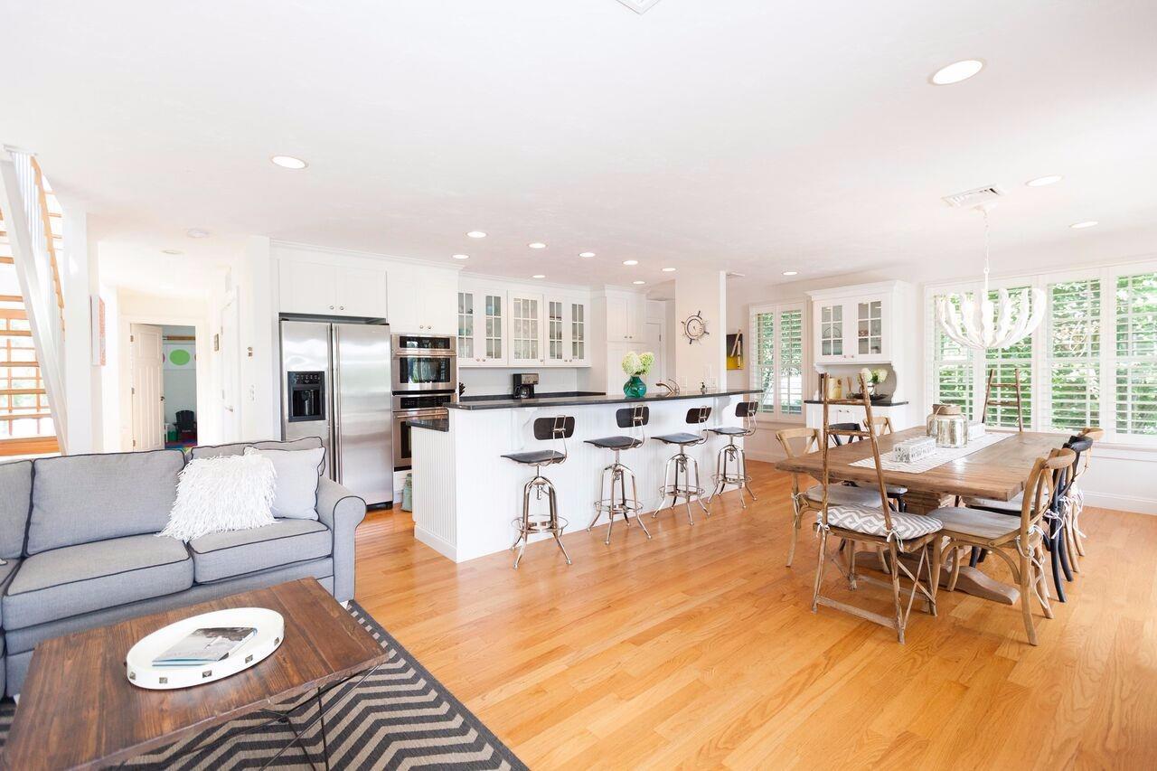 374 Monomoscoy Road Mashpee, MA 02649 - Photo 15 of 29 a living room with lots of furniture and kitchen view