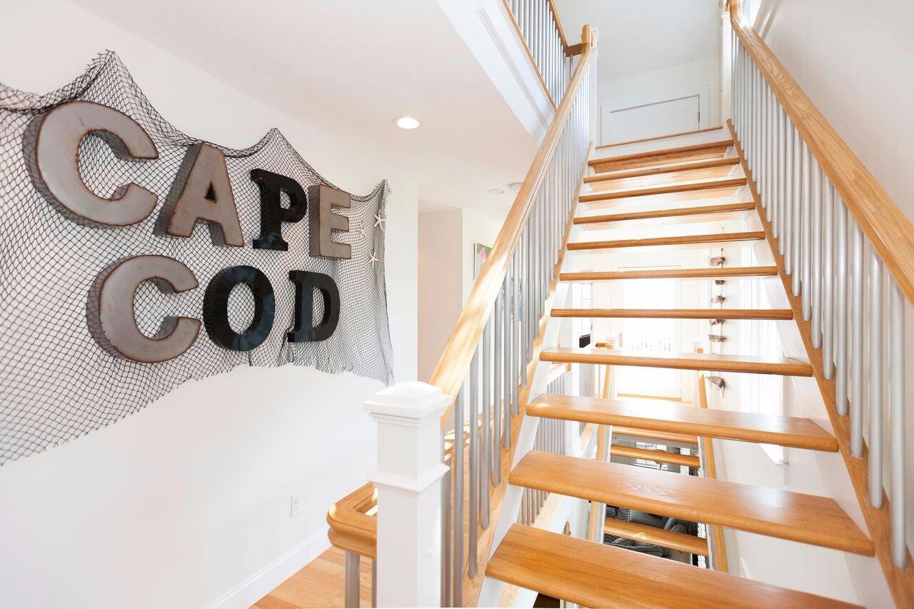 374 Monomoscoy Road Mashpee, MA 02649 - Photo 26 of 29 a view of a storage & utility room with racks on the wall