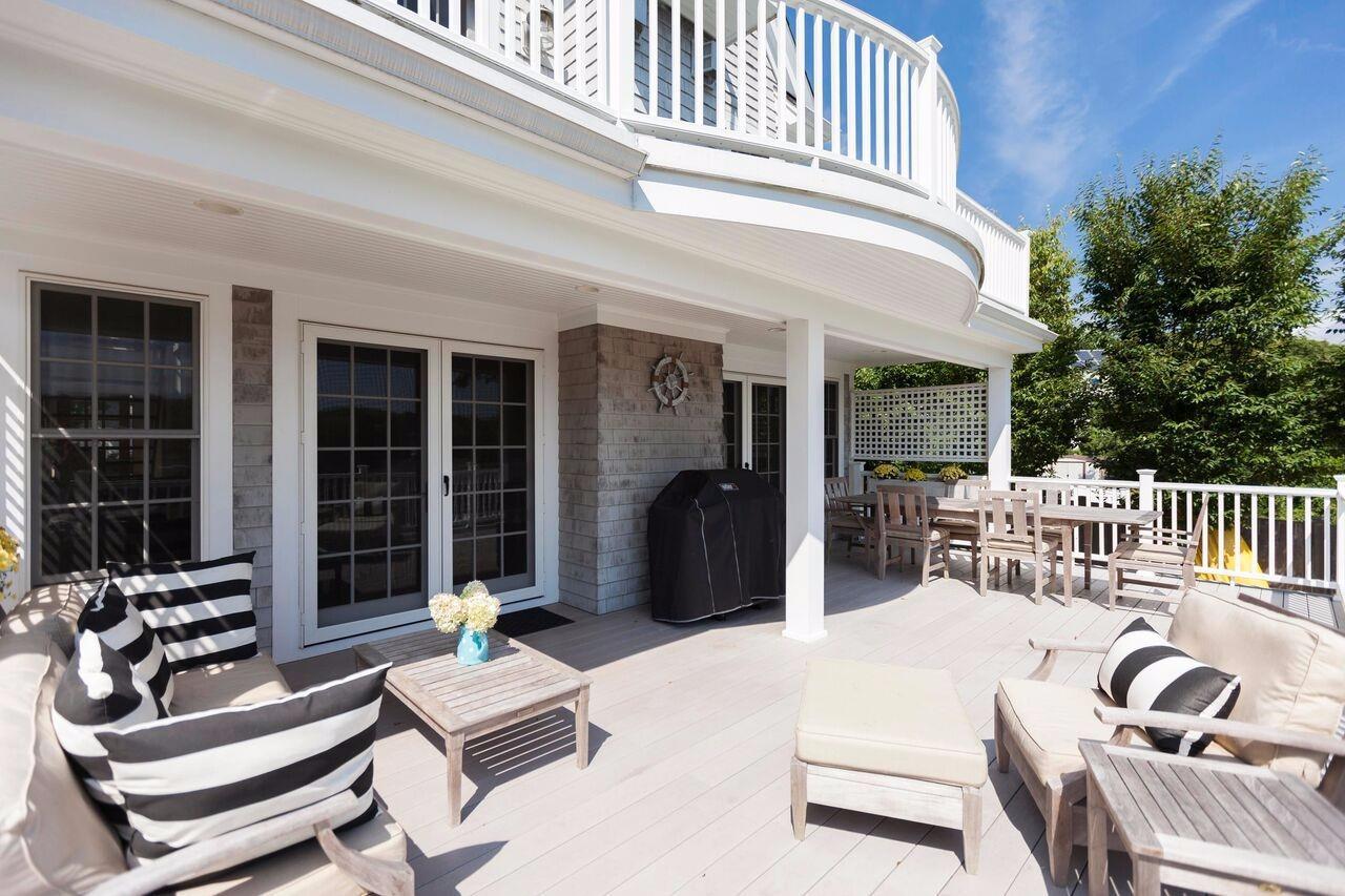 374 Monomoscoy Road Mashpee, MA 02649 - Photo 10 of 29 a building outdoor space with patio furniture