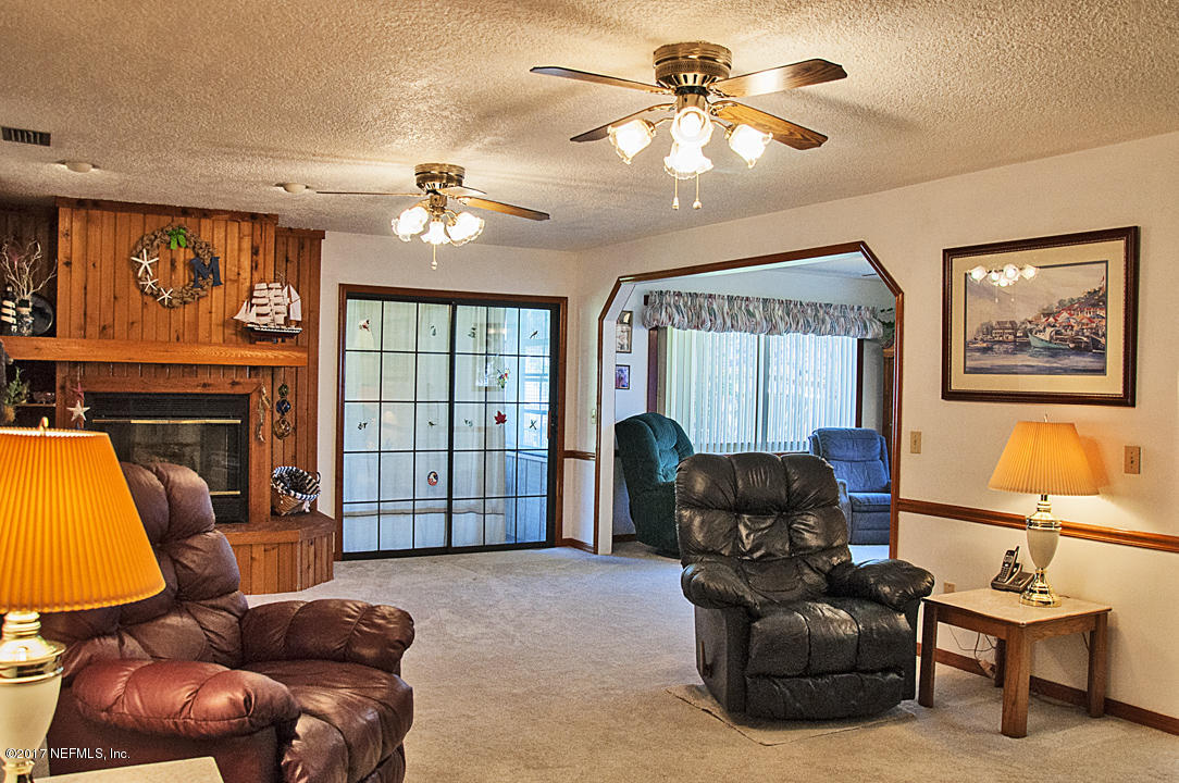 145 Tanager Road St. Augustine, FL 32086 - Photo 3 of 43 a living room with furniture a ceiling fan and a window