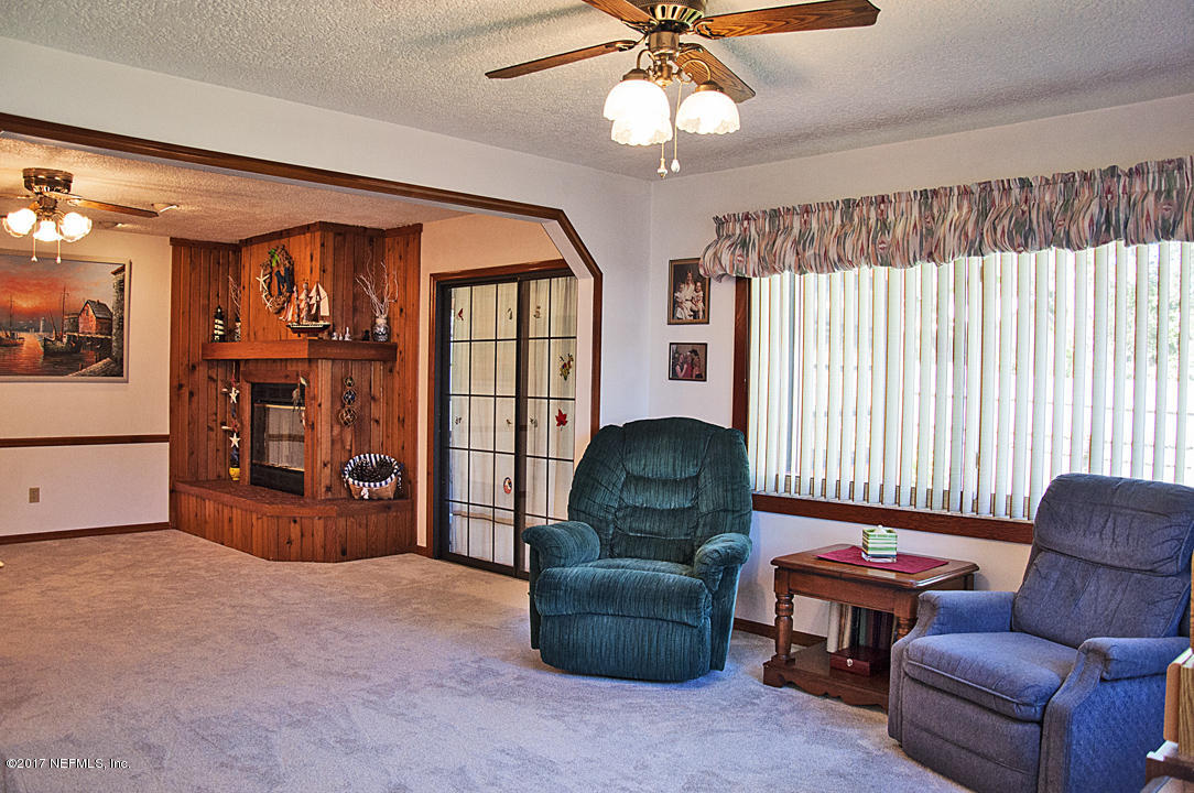 145 Tanager Road St. Augustine, FL 32086 - Photo 7 of 43 a living room with furniture and a window