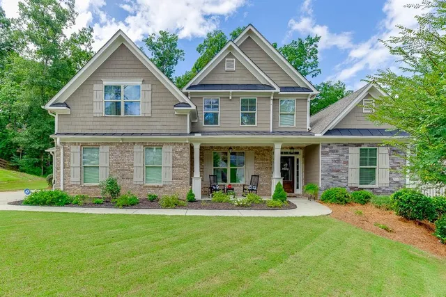 a front view of a house with garden