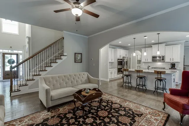 a living room with furniture and a rug