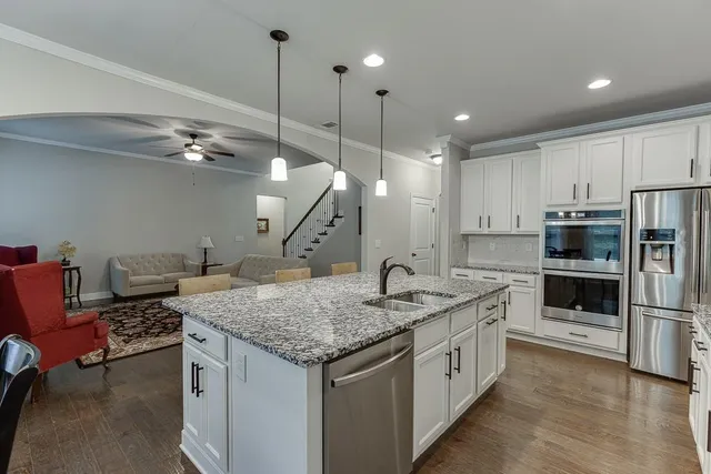 a living room with furniture and a fireplace