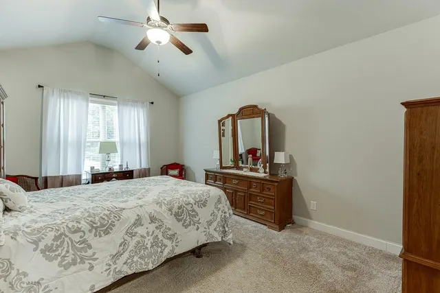 a en suite bathroom with double sink and a mirror