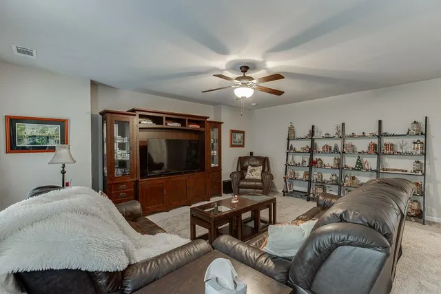 a bathroom with a sink a toilet and shower curtain