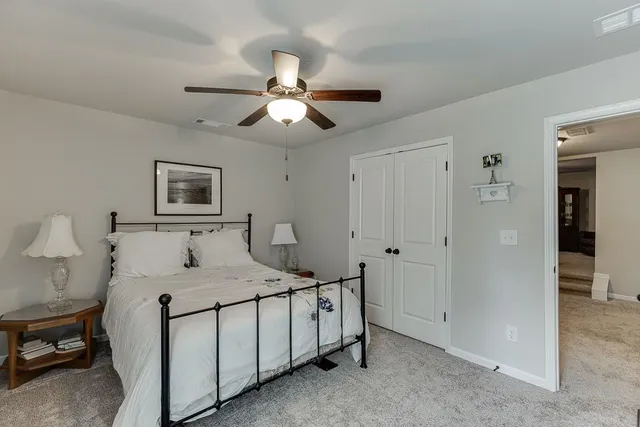 an aerial view of a house with swimming pool garden and patio