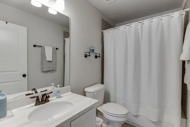 a view of a park with iron fence