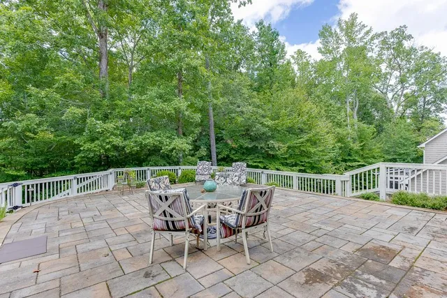 an aerial view of a house with a yard and swimming pool