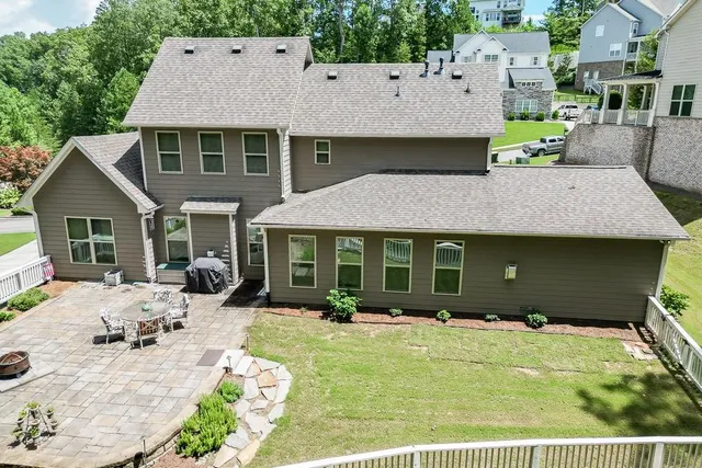 a living room with a table chairs and a fireplace