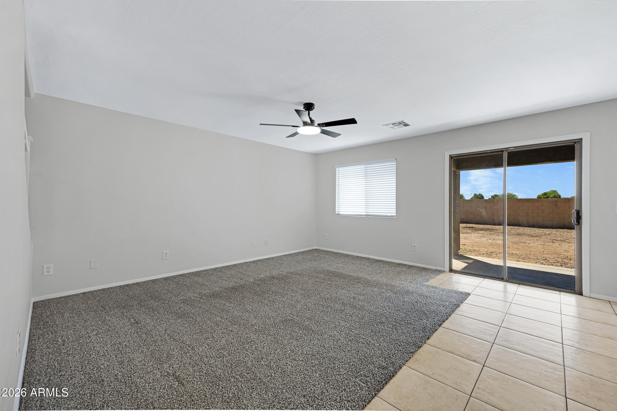 19408 North Braden Road Maricopa, AZ 85138 - Photo 8 of 51 wooden floor in an empty room with a window