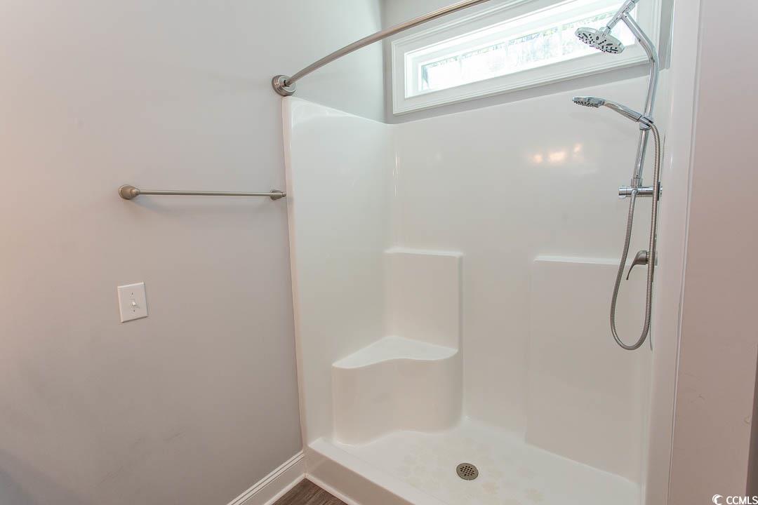 126 Allsbrook Road Loris, SC 29569 - Photo 21 of 30 Bathroom featuring a shower stall and baseboards