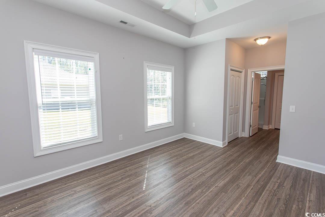 126 Allsbrook Road Loris, SC 29569 - Photo 23 of 30 Empty room with dark wood-style flooring and a ceiling fan
