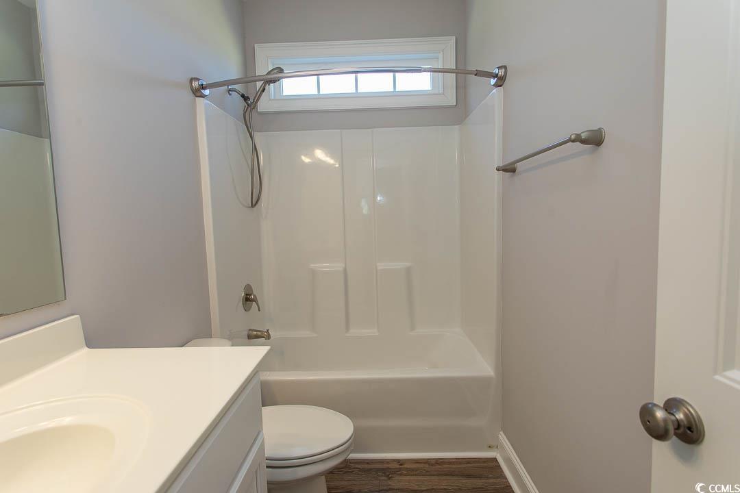 126 Allsbrook Road Loris, SC 29569 - Photo 26 of 30 Full bath with shower / bath combination, vanity, and dark wood finished floors