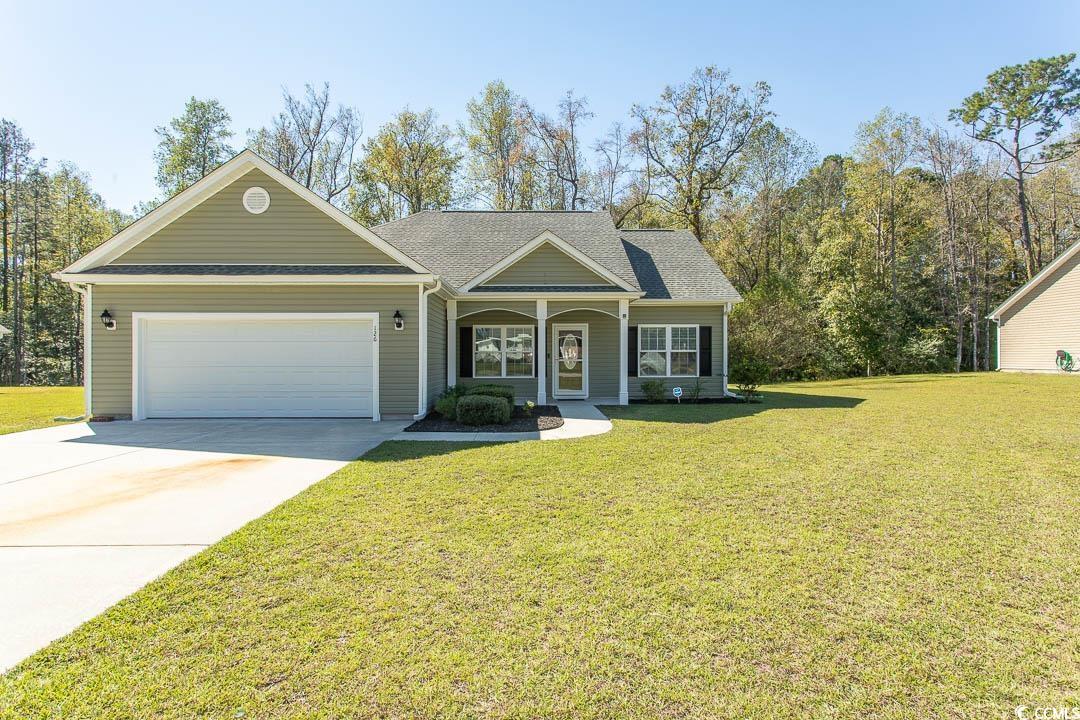 126 Allsbrook Road Loris, SC 29569 - Photo 3 of 30 View of front facade featuring covered porch, a front yard, and concrete driveway