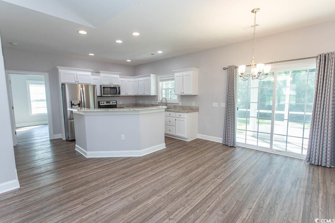 126 Allsbrook Road Loris, SC 29569 - Photo 9 of 30 Kitchen with recessed lighting, white cabinets, decorative light fixtures, a chandelier, and dark wood-style flooring