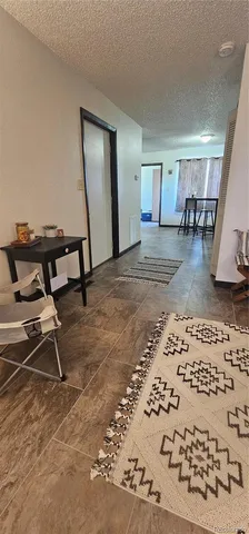 a view of a livingroom with furniture and a rug