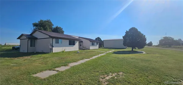 a house with garden in front of it