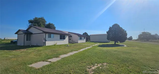 a house with garden in front of it