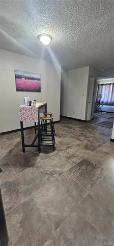 a view of room with furniture and window