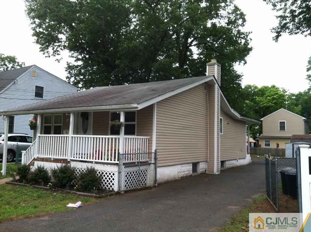 31 Brookside Road Spotswood, NJ 08884 - Photo 1 of 11 a front view of a house with garage