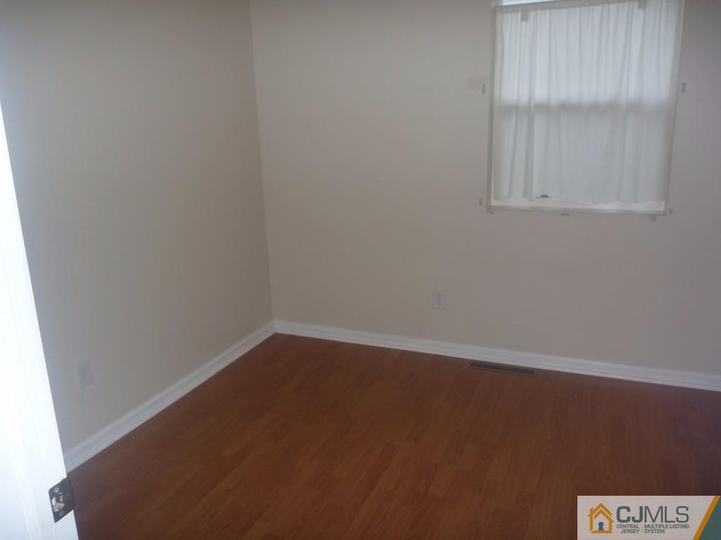 31 Brookside Road Spotswood, NJ 08884 - Photo 6 of 11 an empty room with a window