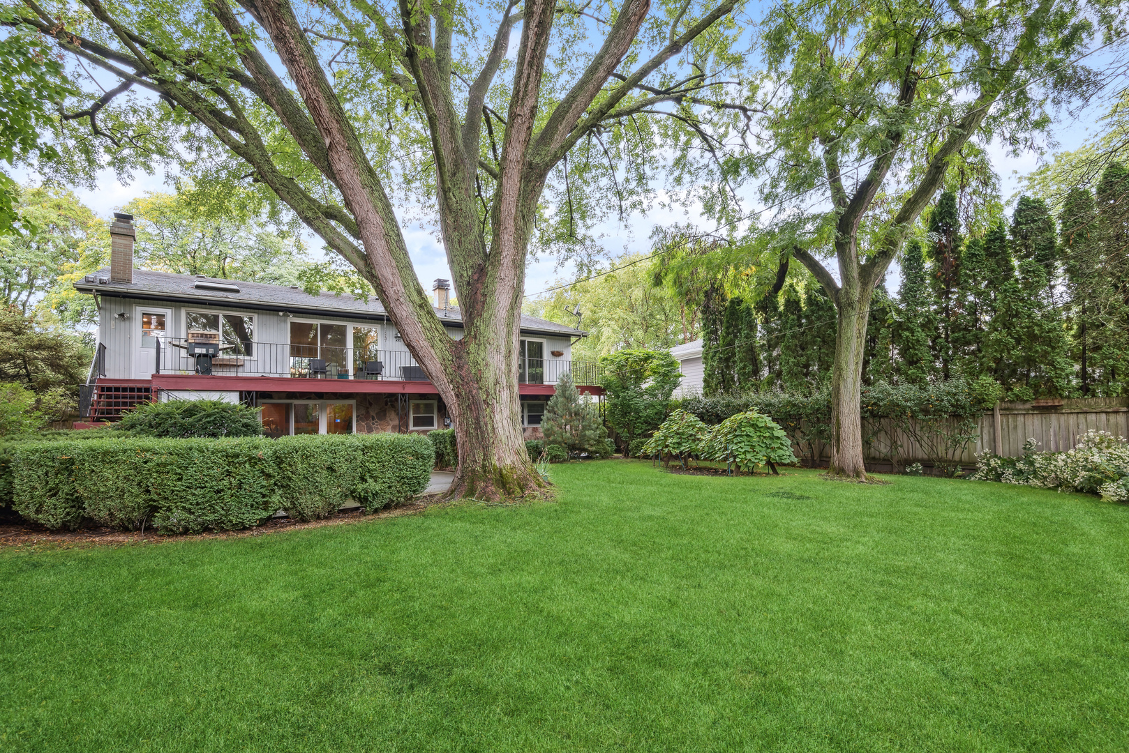 430 Sandy Lane Wilmette, IL 60091 - Photo 5 of 6 a house with a tree in front of a house