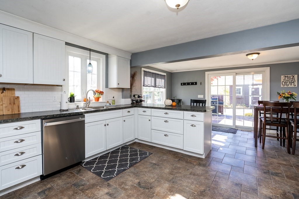 120 Stebbins Road Monson, MA 01057 - Photo 23 of 41 a kitchen with granite countertop white cabinets and white appliances
