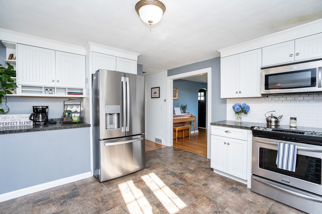 120 Stebbins Road Monson, MA 01057 - Photo 27 of 41 a kitchen with granite countertop a refrigerator stove and sink