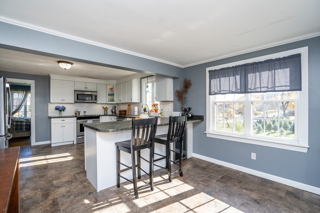 120 Stebbins Road Monson, MA 01057 - Photo 31 of 41 a view of a dining room with furniture and a window